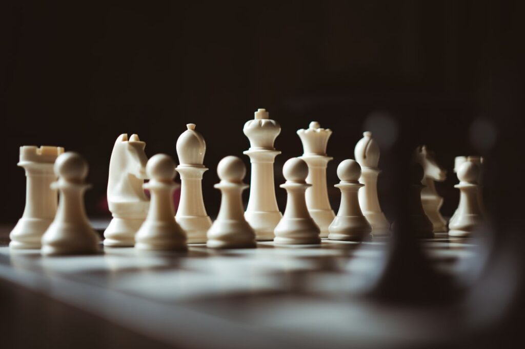 Crafting Captivating Headlines: Your awesome post title goes here Detailed close-up view of white chess pieces on a chessboard, highlighting strategy and focus.