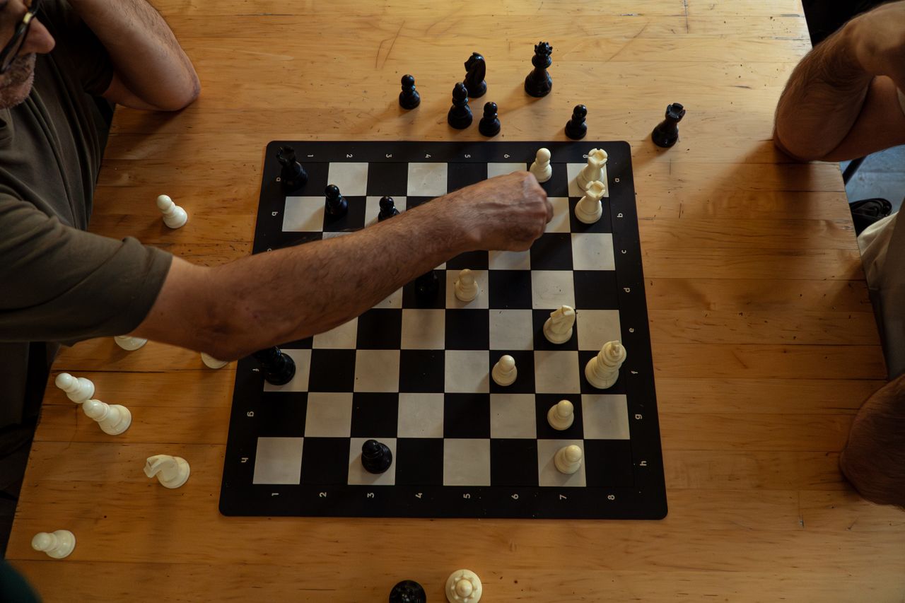 Chess players strategizing during a game in Istanbul, Türkiye.
